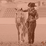 A youth exhibitor leaving the show arena with their Paint Horse.