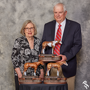 Two Hall of Fame inductees with their trophies.