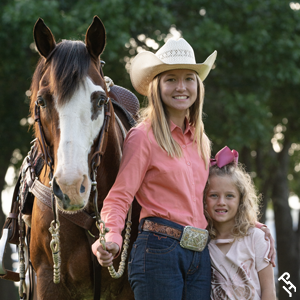 Two youth members with their Paint Horse.