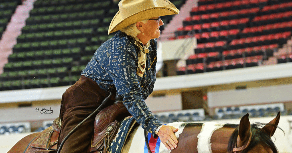 Amateur Ranch Pleasure champion celebrating in the arena.