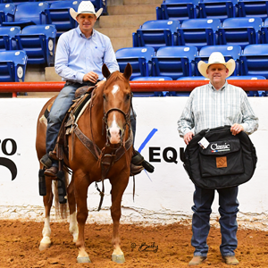 A roper receiving his awards at World Show.