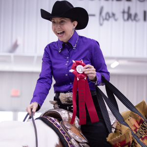 A happy exhibitor with their Eastern National ribbon.