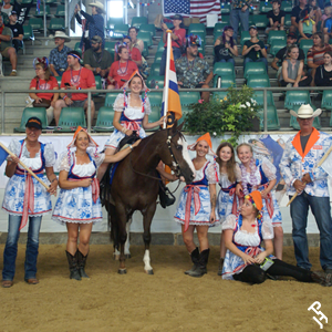 Team Netherlands standing proudly with their flag.