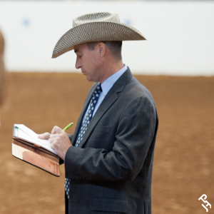 A judge taking notes during a class.