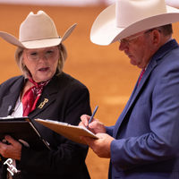 A judge talking to their scribe.