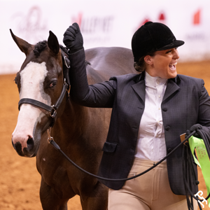 An amateur member celebrating in the arena.