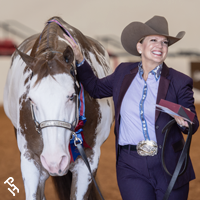 World Show champion happily leaving the arena with her buckle.