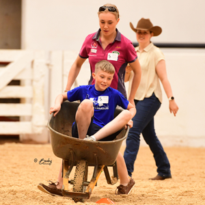 A team competing in the wheelbarrow race at YTT.