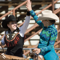 Two youth members high fiving.