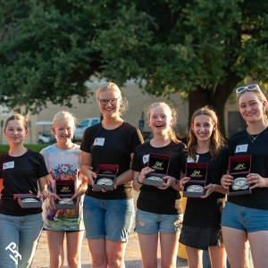 Youth Team Tournament champion team with their buckles.